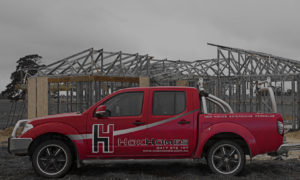 Troy on building site with Hok Homes clients