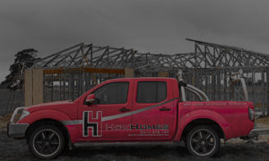 Troy on building site with Hok Homes clients